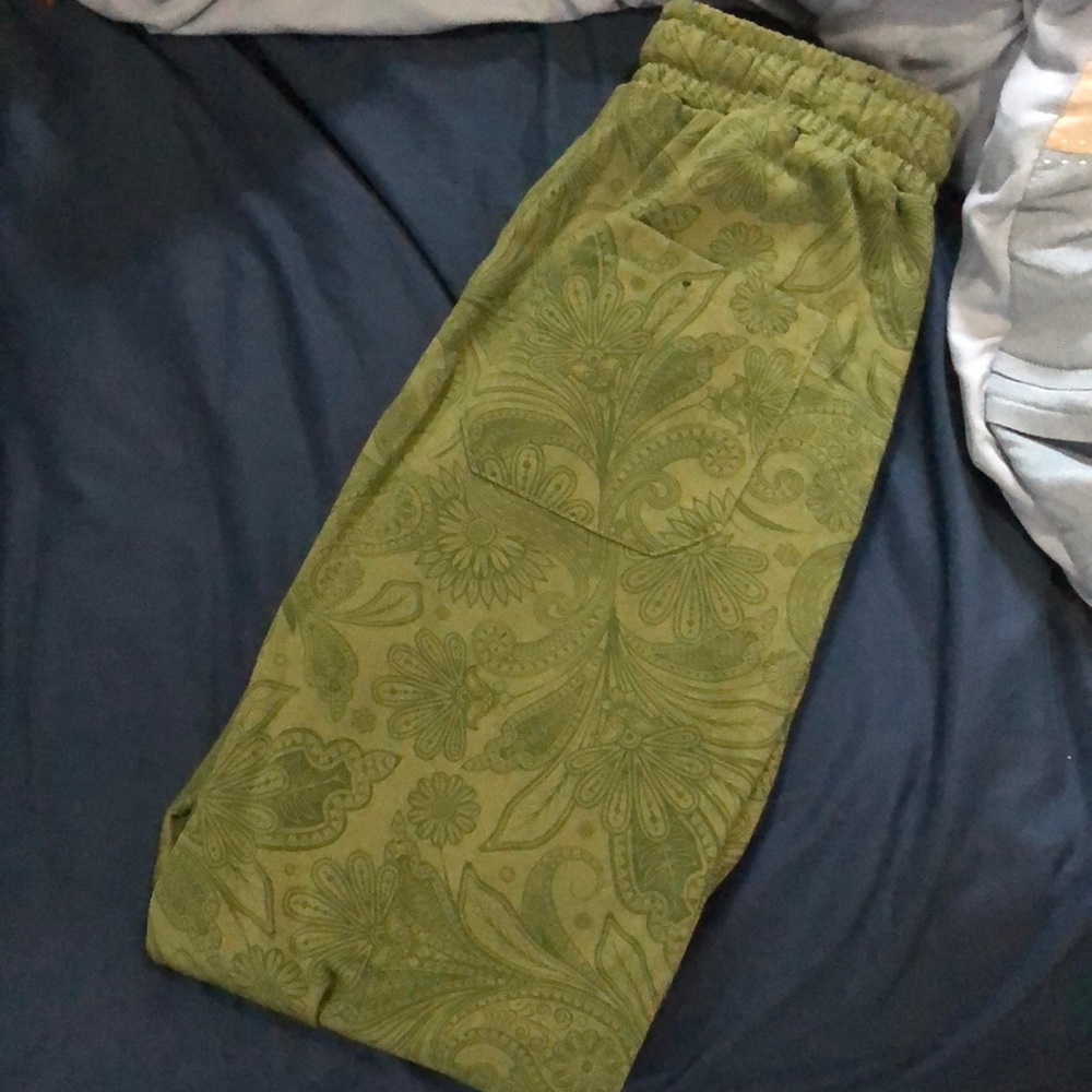 Dark green paisley-designed joggers